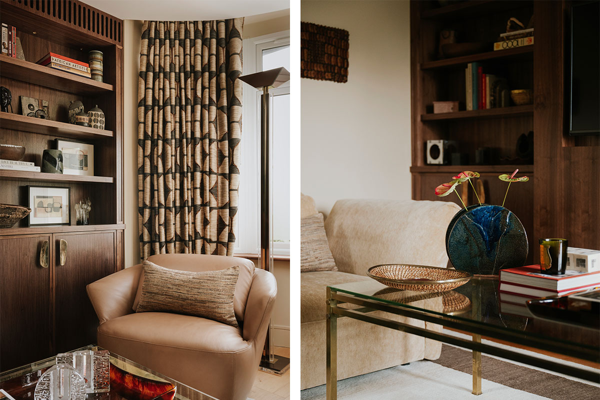 Warm neutral seating, brass and glass table and a tan leather chair layered against walnut joinery and patterned drapery.