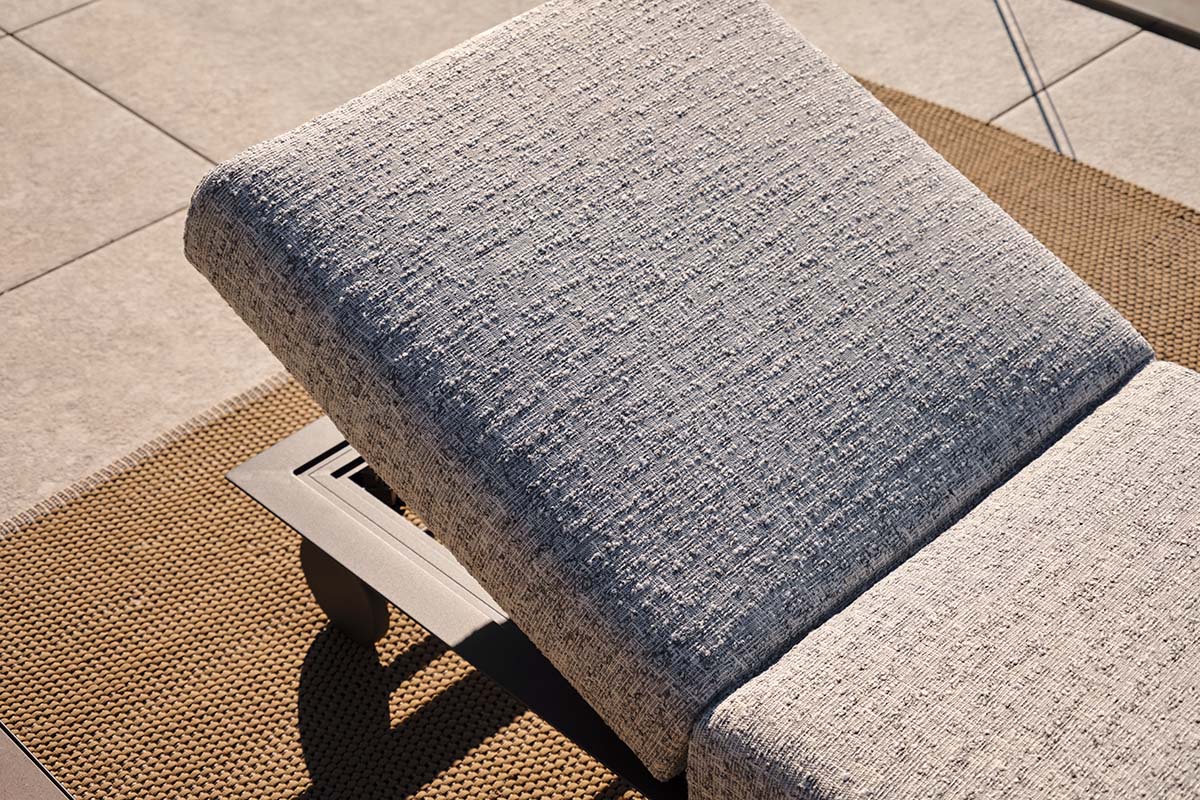 Close-up of a King Cove Sun Lounge upholstered in Meridian Silver Mist fabric, highlighting its textured weave and adjustable backrest.