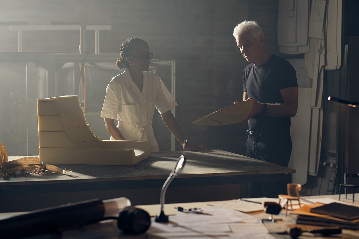 Founder David King and a King Living designer shaping a foam sofa prototype in the studio.