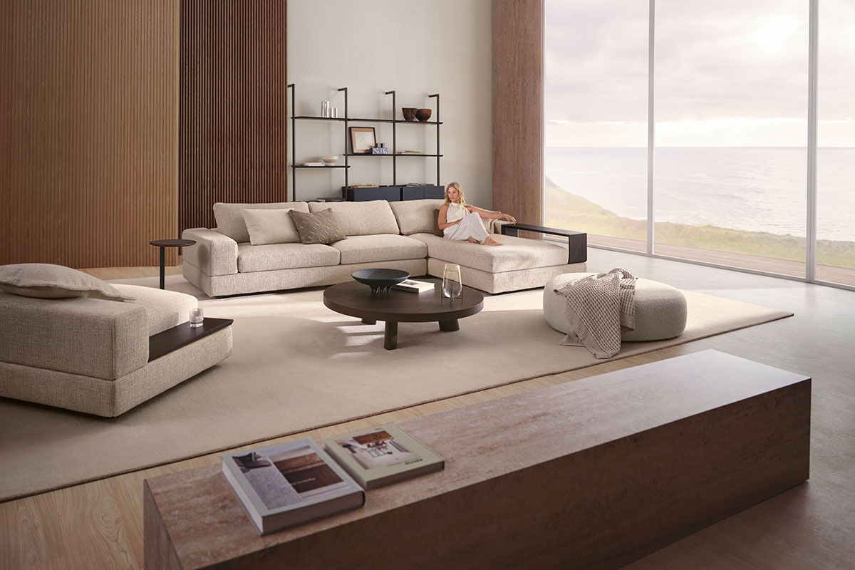 King Living modular sofa in a neutral fabric, styled in a light-filled coastal living room.