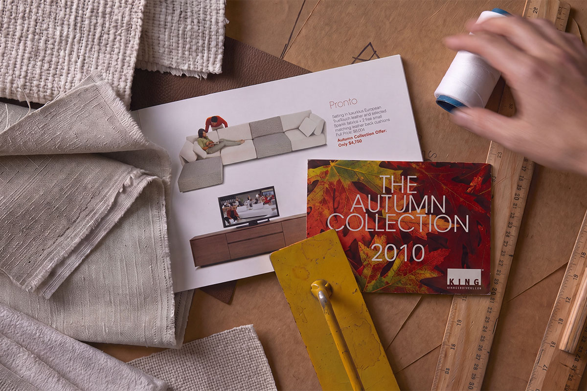Flat lay image from above of King Living’s Autumn Collection Pronto Sofa product cards from 2010.