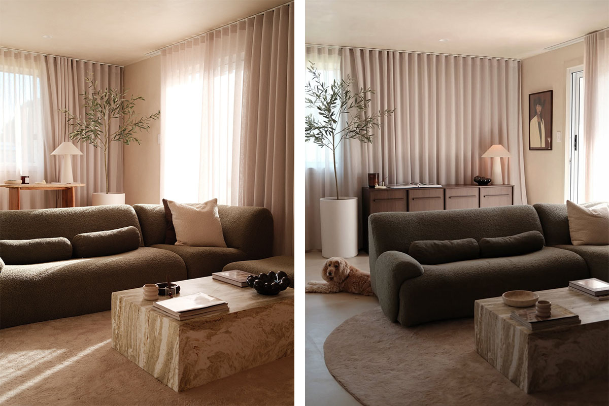 Deep green curved modular sofa styling in an earthy neutral room with a round stone table, plants and a sleeping dog.